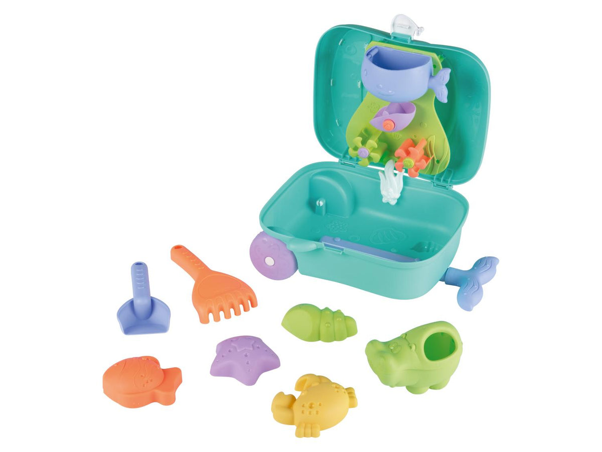 Valise à roulettes avec jouets de plage