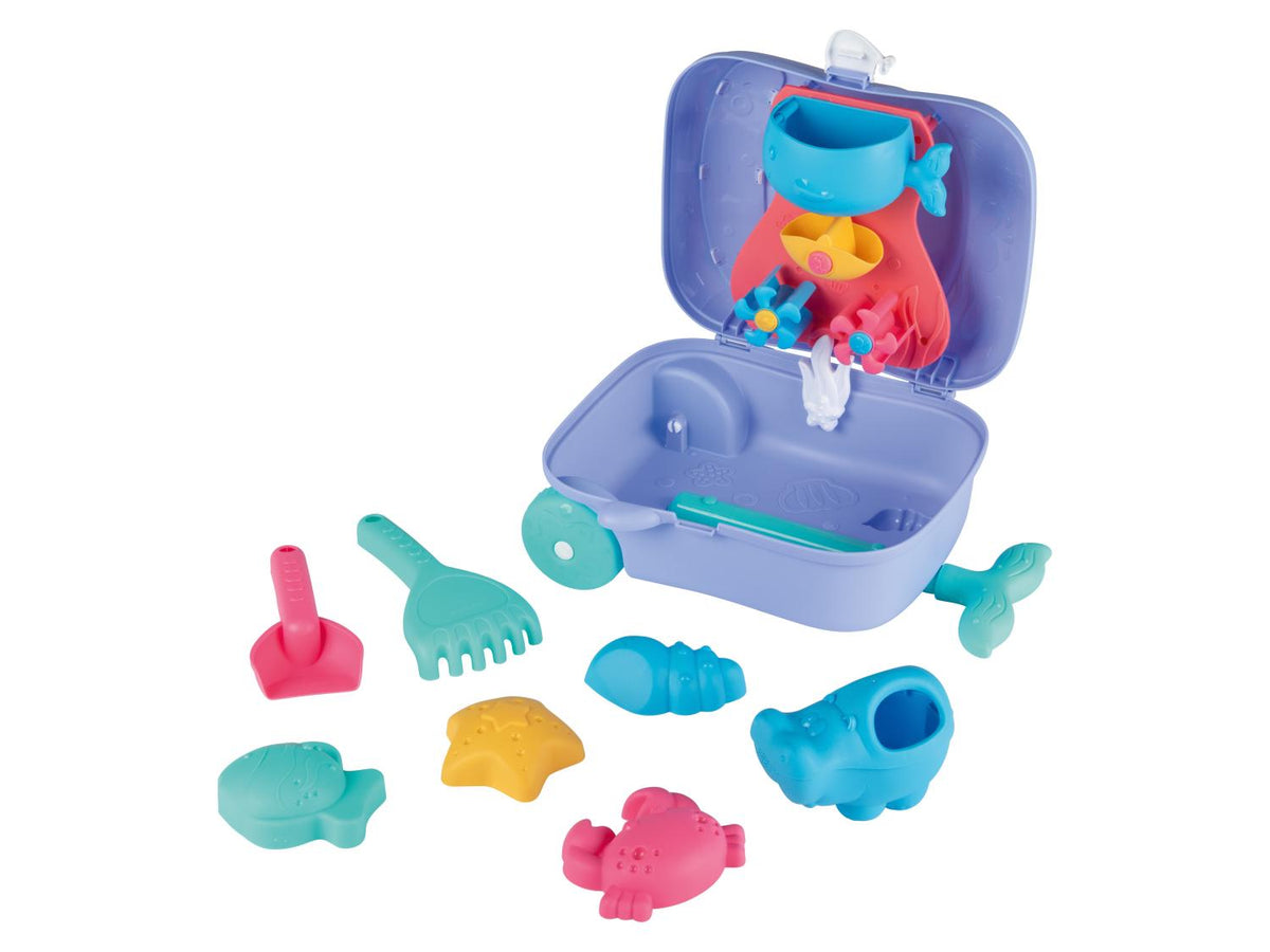 Valise à roulettes avec jouets de plage