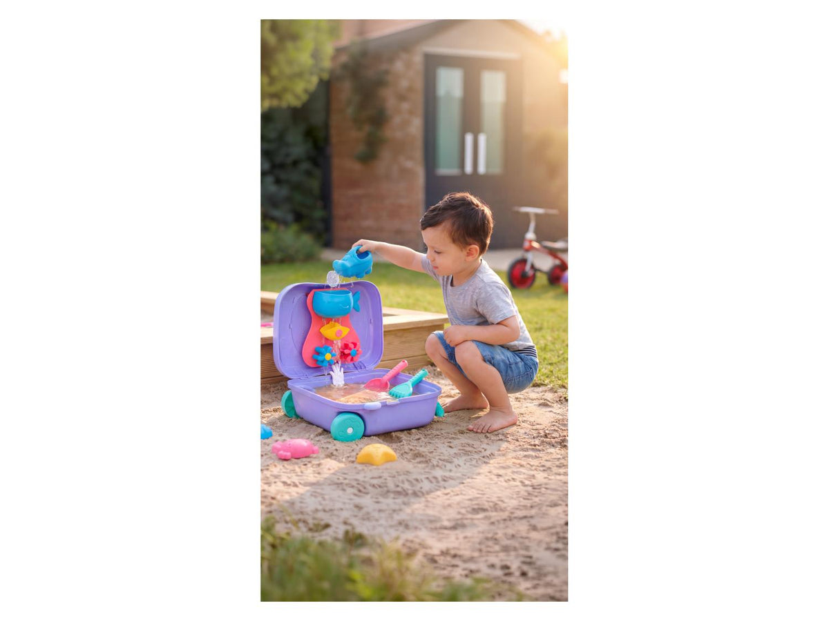 Valise à roulettes avec jouets de plage